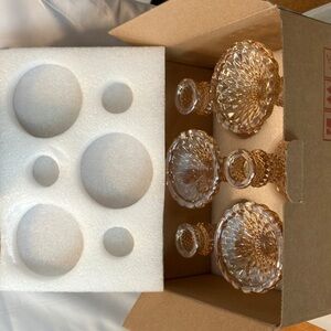 New in box. Beautiful set of 6  golden  irredescent  4”high candlestick set